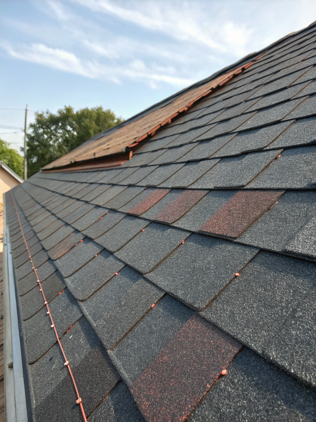 Professional roofing installation on a residential property